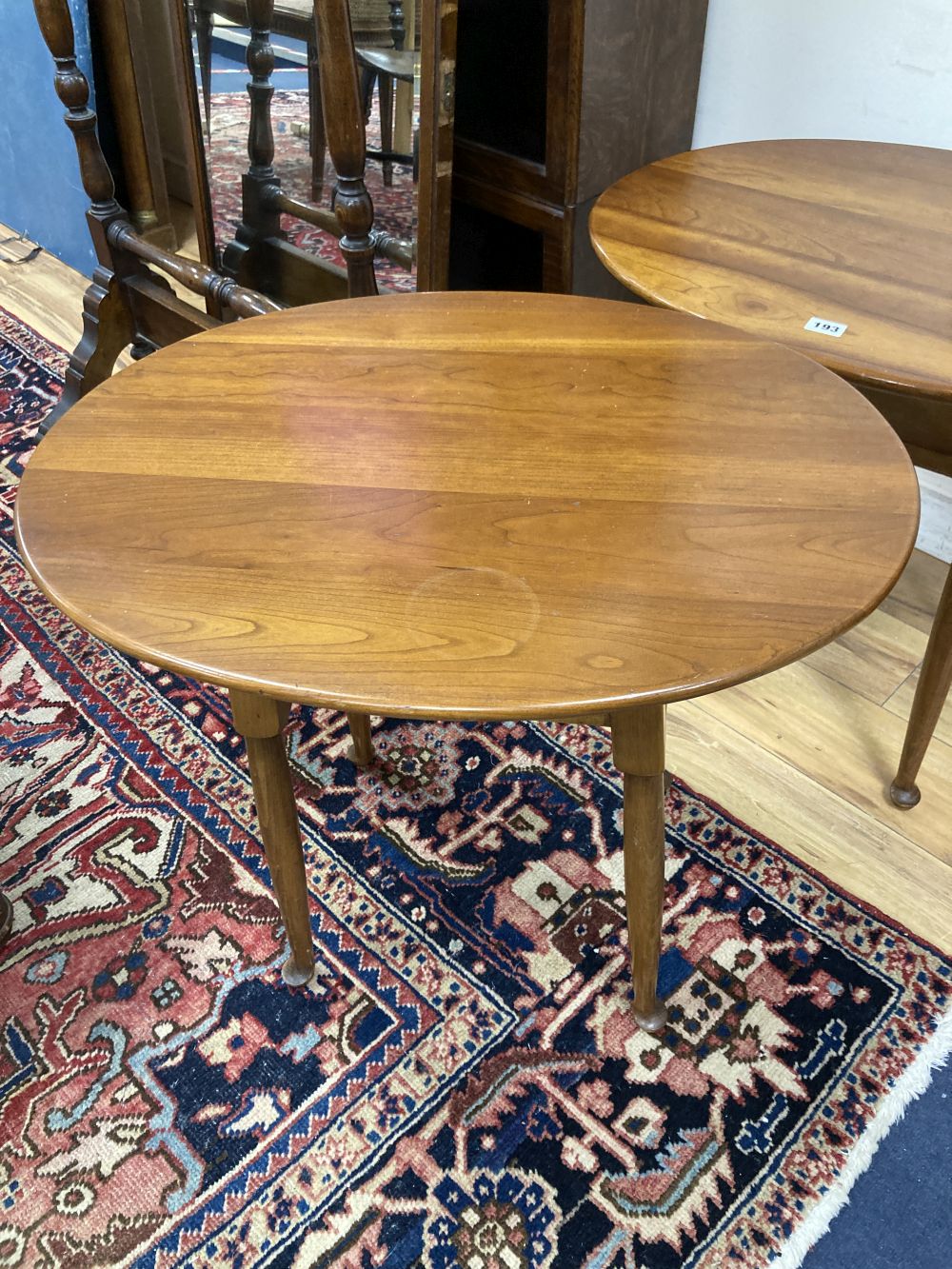 A pair of Leopold Stickley cherrywood side tables, width 65cm depth 49cm height 58cm